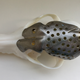 The custom-built, 3D-printed titanium skull cap.